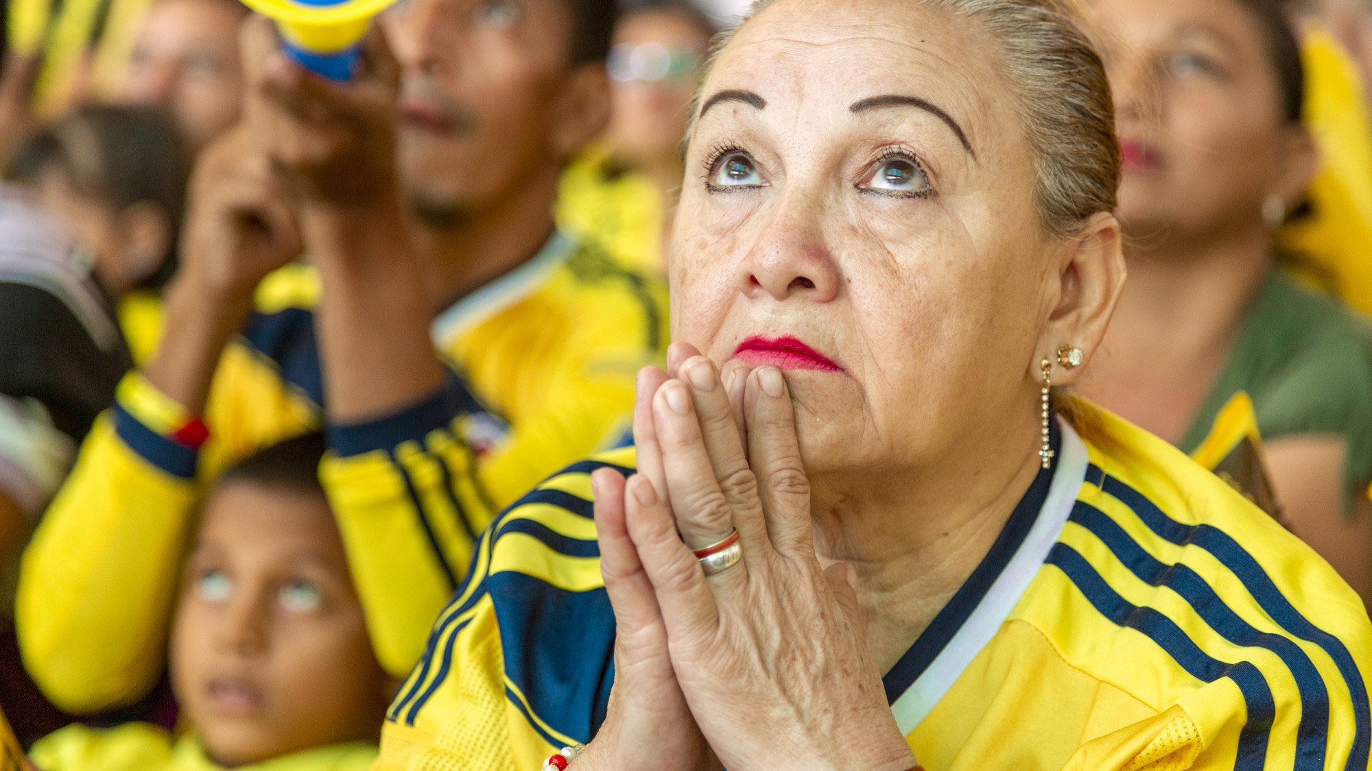 A woman watches the Colombian national team during the World Cup